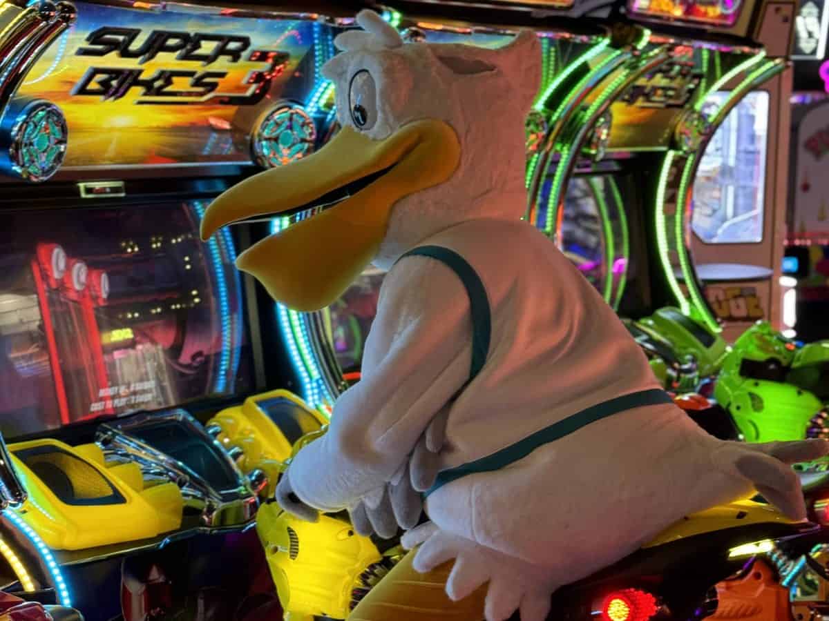Kokomo Joe's pelican mascot riding the Super Bikes 3 arcade game